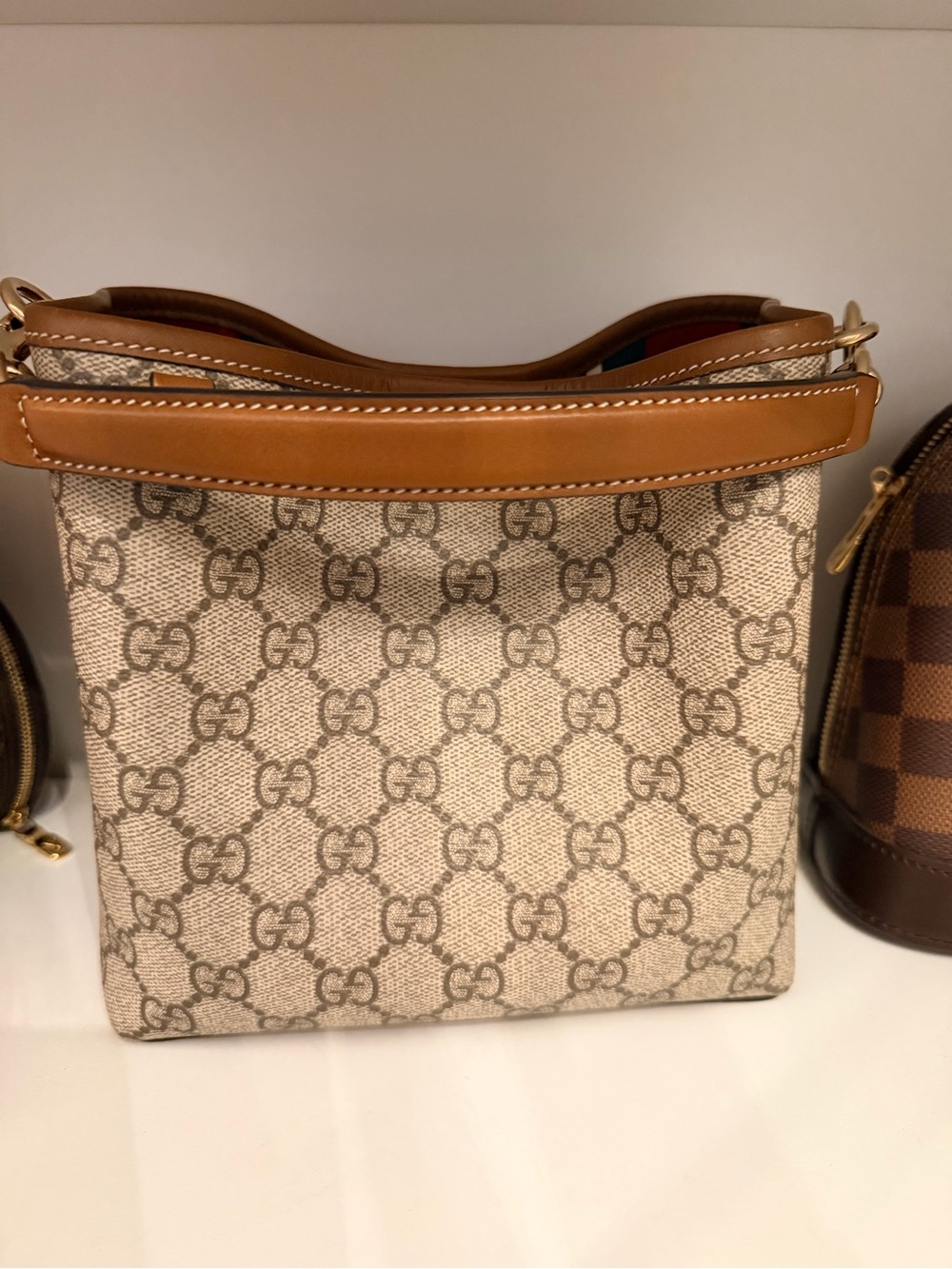 Gucci GG EMBLEM SMALL BUCKET BAG